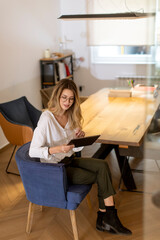 Young woman working with digital tablet in the office
