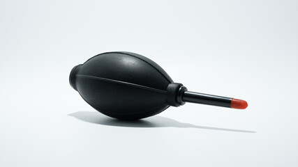 Black Air Blaster dust cleaner on white background for camera lenses. Copy Space