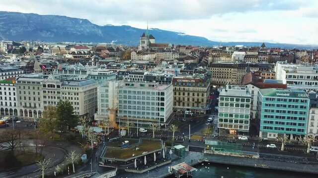 Aerial view of Geneva and aerial view of water jet fountain. Drone flying over the picturesque cityscape 