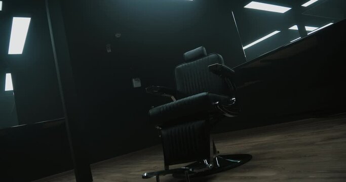 Barbershop room with two working places in the beauty salon. Hair salon interior. Empty chairs in styled barbershop. Chairs and mirrors in modern hairdressing. Interior of a modern hair salon