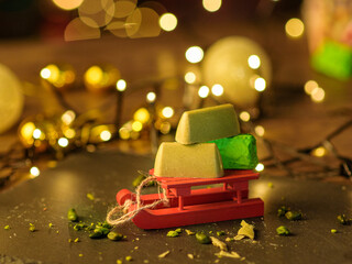 Pistachio candies on the background of the Christmas tree