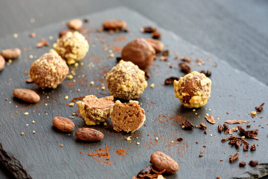 Handmade chocolates sprinkled with pistachio crumbs 