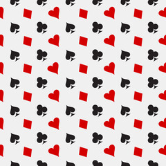 Seamless stylish pattern of red and black symbols of card suit - clubs, tambourines, spades, hearts on a white background.Vector graphics for design and decoration.