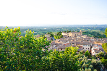 Fototapeta na wymiar A Tuscan landscape with Sant'Agostino church in San Gimignano, Italy