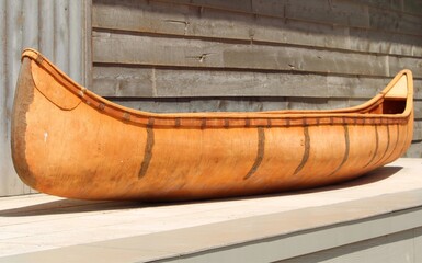 vintage indigenous birch canoe elevated on platform