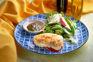 Grilled chicken fillet with fresh salad - arugula and tomato. Ketogenic food. Healthy lunch.