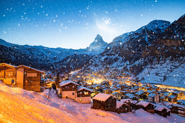 snowing in Zermatt traditional Swiss ski resort under the Matterhorn