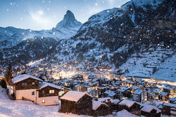 snowing in Zermatt traditional Swiss ski resort under the Matterhorn