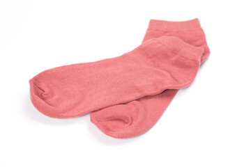 Pair of pink short socks on white background, top view