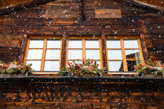  traditional Swiss wooden hut and snowfall
