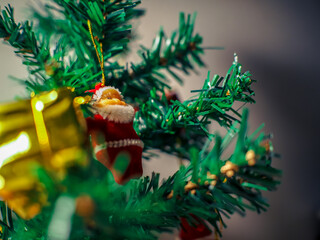 close up of a small Santa doll with Christmas tree on  Christmas festival