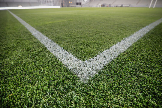 Shallow depth of field (selective focus) image with the corner point of a soccer field.