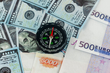 dollars euros and rubles and compass, the concept of currency fluctuations