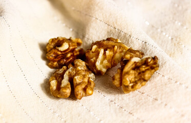 Walnut kernel halves on a light background.