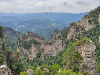 Fototapeta na wymiar The sandstone pillars. Mountain valley. Mountains in the national park Wulingyuan. Zhangjiajie. UNESCO World Heritage Site. China. Asia
