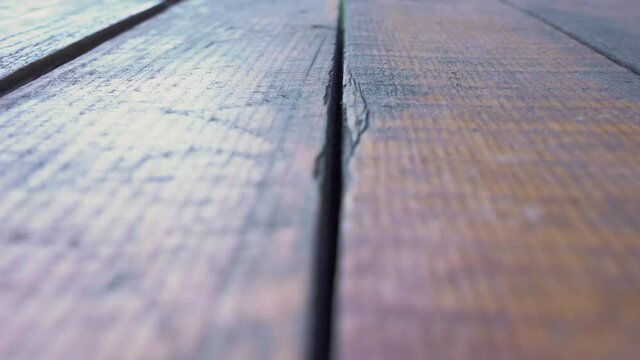 Closeup low angle view of brown weathered wooden floor of terrace.