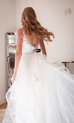 Beautiful Woman Trying on Wedding Dress