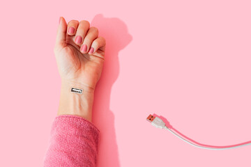 Digital composite image of female hand with USB port