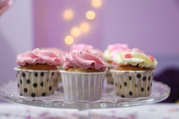 Sweet pink birthday cupcakes with strawberries 