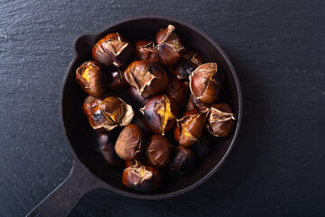 Tasty fried chestnut snack background