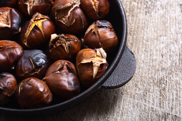Tasty fried chestnut snack background