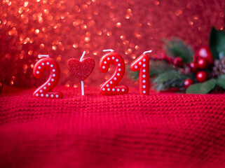 Numbers 2021 on red background with bokeh. New year numbers.