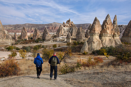 Dad and son walk through the fabulous landscapes of Cappadocia. Turkey