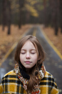 Girl in a plaid coat with