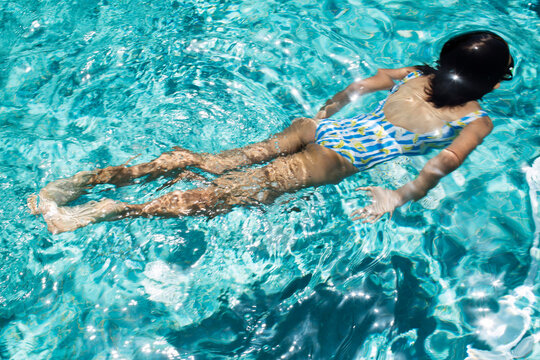 Girl swimming in the pool