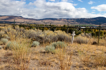 autumn cemetary landscape with mountains and sky