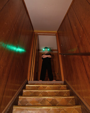 Spy Boy Looking in Scary Basement