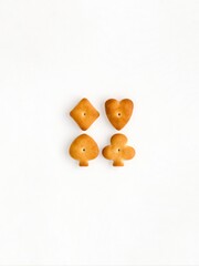crackers in the form of card suits: diamond, heart, club and spade