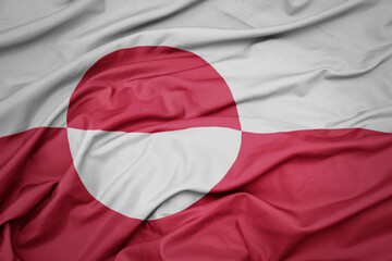 waving colorful national flag of greenland. © luzitanija