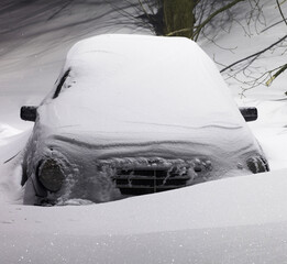 Snow-covered car after snowfall