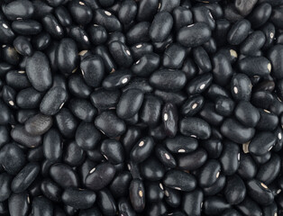Top closeup view of black beans. Food backdrop