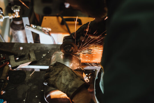 Men build a motorcycle