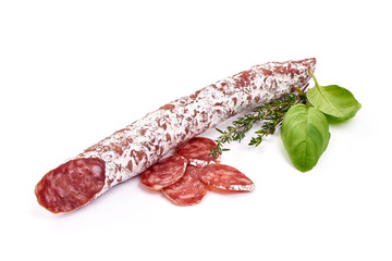 Traditional Spanish Fuet thin dried sausage with slices, Close-up, isolated on a white background