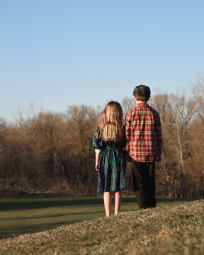 Mystery Friends Standing Alone on Hill Togther