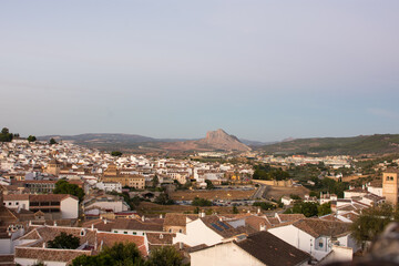 Obraz premium Antequera town seen from above. Andalusian village with the white houses at sunset. Malaga, Andalusian, Spain.