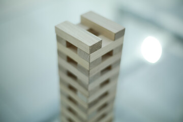 Wood Jenga on glass table