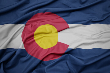 waving colorful flag of colorado state. - obrazy, fototapety, plakaty