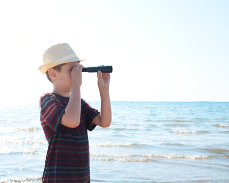 Beach Boy Searching by Water Beach with Mono-scope