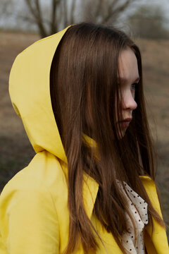 Portrait of a girl in a yellow hood