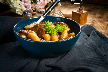 Beef stew in gravy.