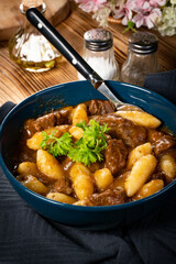 Beef stew in gravy.