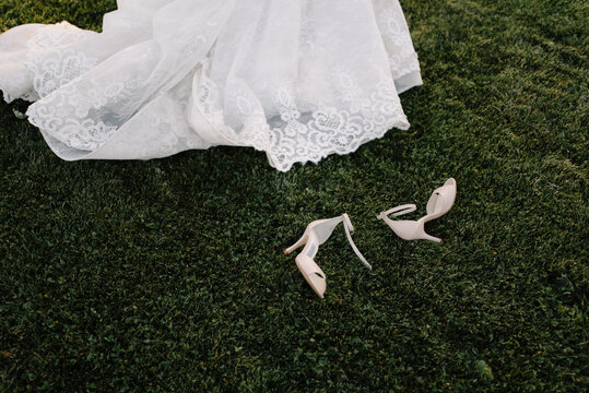 wedding dress and shoes on grass