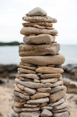 Fototapeta na wymiar Stack of pebble stones formed as a tower