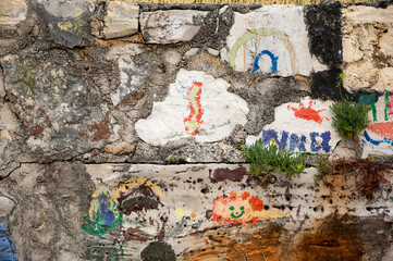 Artwork of children finger painting on a wall