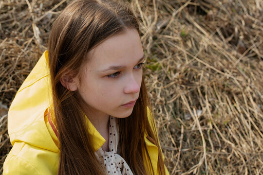 Portrait of a girl in a yellow hood
