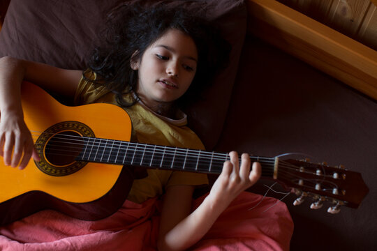 Teen girl with a guitar